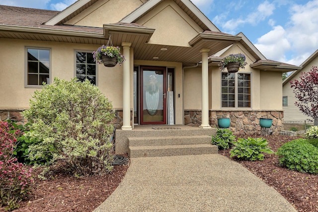 10283 Ferry Point Pl NW, Rice, MN 56367 - property entrance with stucco siding and stone siding