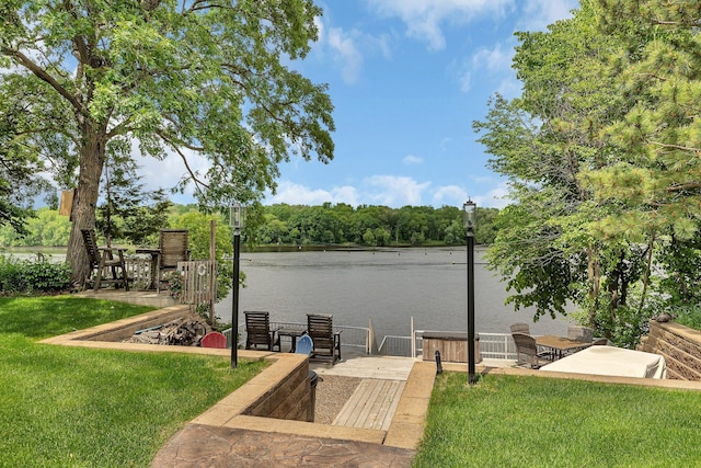 10283 Ferry Point Pl NW, Rice, MN 56367 - view of green lawn with a water view and a dock
