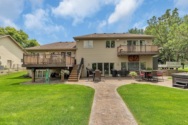 10283 Ferry Point Pl NW, Rice, MN 56367 - back of house with stairway, a patio area, a deck, and a hot tub