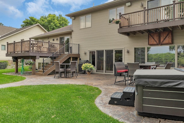 10283 Ferry Point Pl NW, Rice, MN 56367 - rear view of property with a patio area, a yard, a balcony, stairway, and outdoor dining space