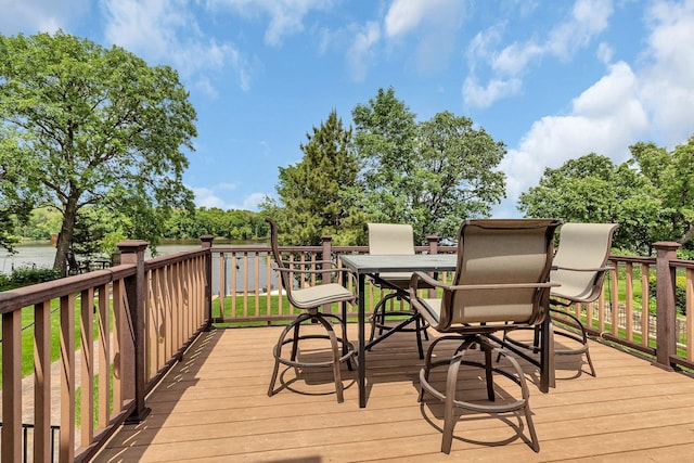 10283 Ferry Point Pl NW, Rice, MN 56367 - deck with outdoor dining space and view of wooded area