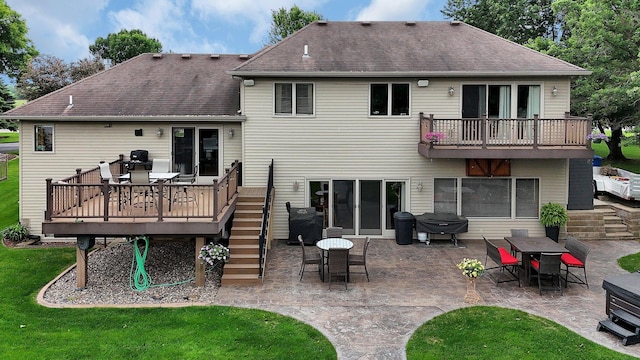 10283 Ferry Point Pl NW, Rice, MN 56367 - back of house with outdoor dining area, a patio, roof with shingles, a yard, and a deck
