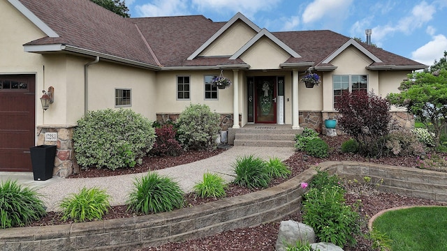 10283 Ferry Point Pl NW, Rice, MN 56367 - view of front facade with stucco siding, stone siding, and a shingled roof