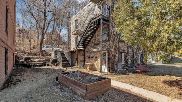 view of property exterior featuring stairway