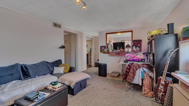living room featuring carpet floors and visible vents