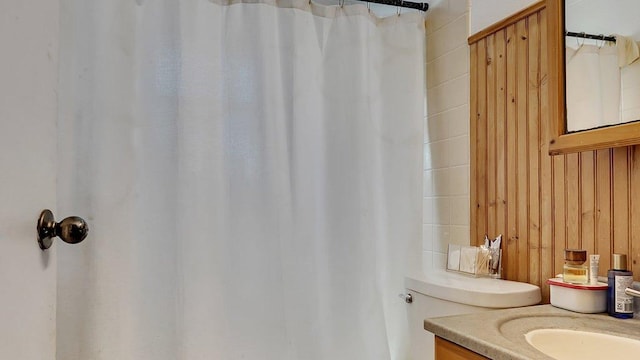 bathroom with vanity and curtained shower