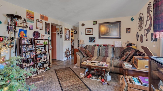 living room with visible vents and carpet