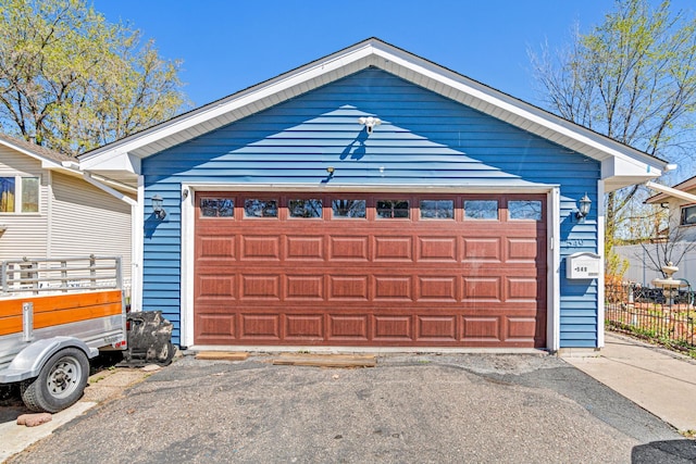 garage featuring fence