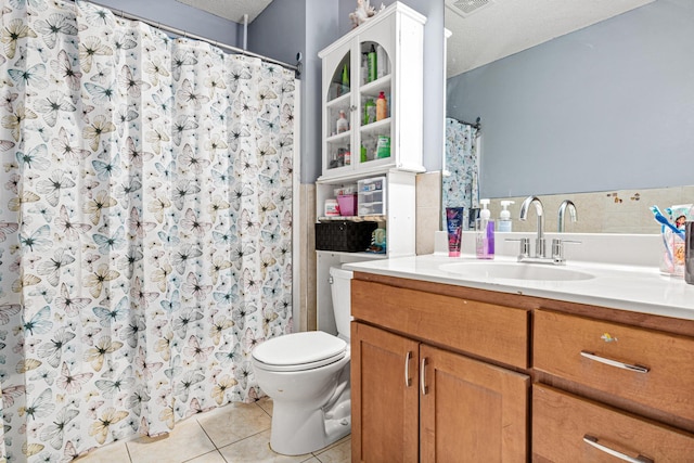 full bath featuring a shower with curtain, visible vents, tile patterned floors, vanity, and toilet