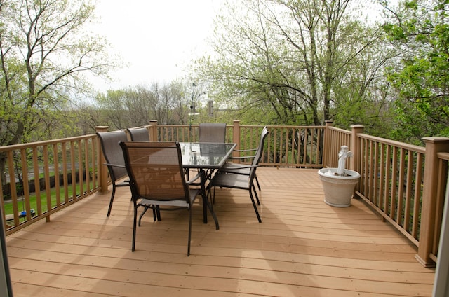 wooden terrace featuring outdoor dining area