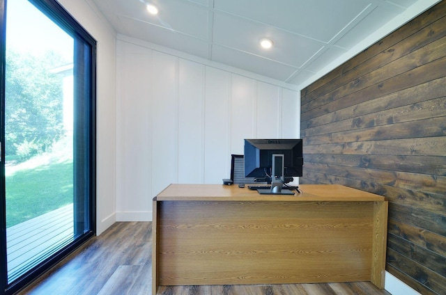 office space featuring baseboards and wood finished floors