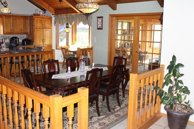 5795 Otter Lake Rd, White Bear Twp, MN 55110 - dining area with light tile patterned floors and a wood ceiling with exposed beams