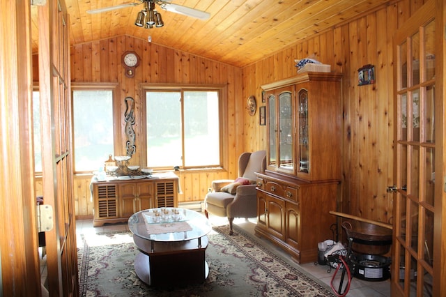 5795 Otter Lake Rd, White Bear Twp, MN 55110 - living area with vaulted ceiling, ceiling fan, wood walls, wooden ceiling, and baseboard heating
