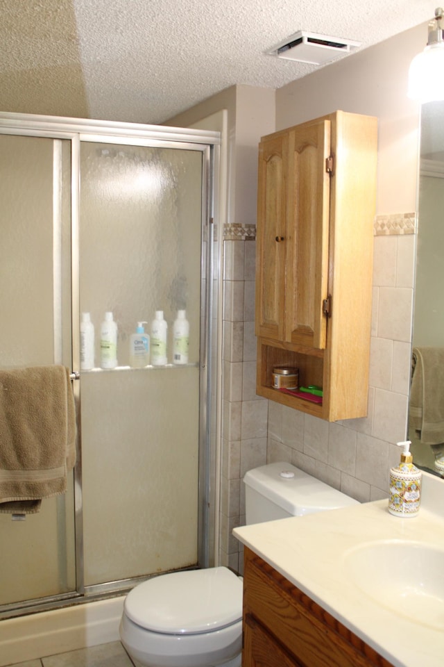5795 Otter Lake Rd, White Bear Twp, MN 55110 - full bath with tile walls, vanity, a shower stall, and a textured ceiling