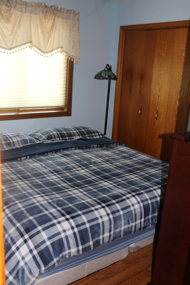 5795 Otter Lake Rd, White Bear Twp, MN 55110 - bedroom featuring a closet and wood finished floors