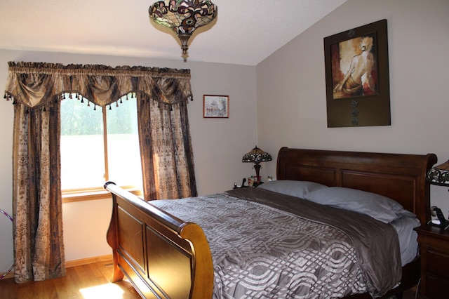5795 Otter Lake Rd, White Bear Twp, MN 55110 - bedroom with light wood-style flooring and lofted ceiling