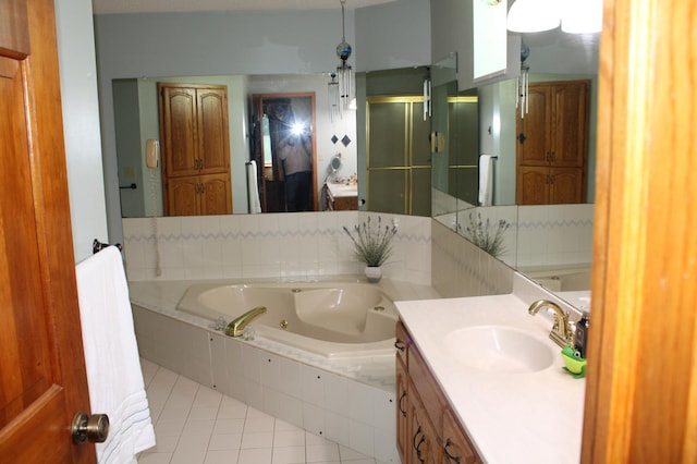 5795 Otter Lake Rd, White Bear Twp, MN 55110 - full bathroom with tile patterned floors, a stall shower, vanity, and a tub with jets