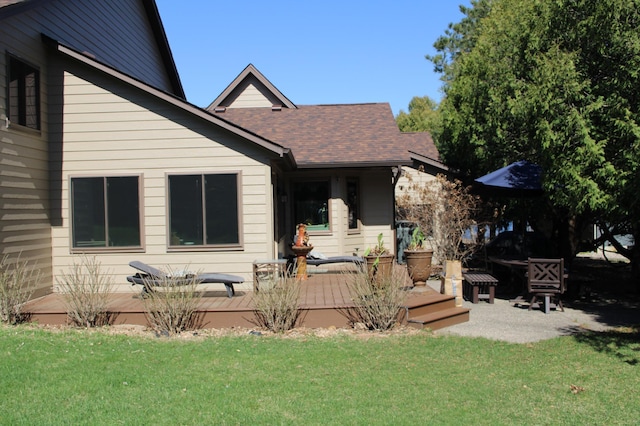5795 Otter Lake Rd, White Bear Twp, MN 55110 - back of house with a yard, a shingled roof, and a deck