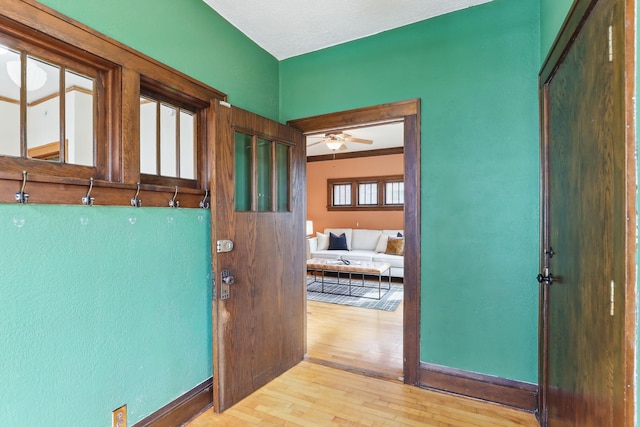 interior space with baseboards and hardwood / wood-style floors