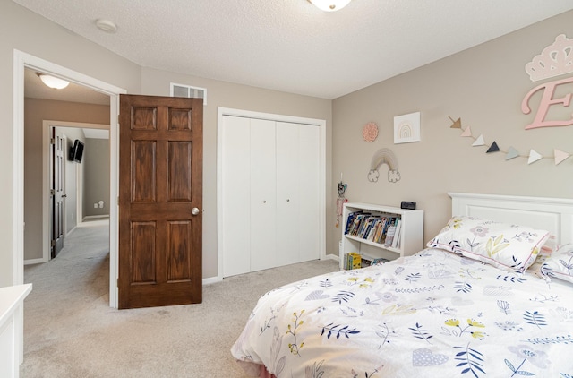 1006 9th Street Ct SE, New Prague, MN 56071 - bedroom featuring light carpet, a closet, and baseboards