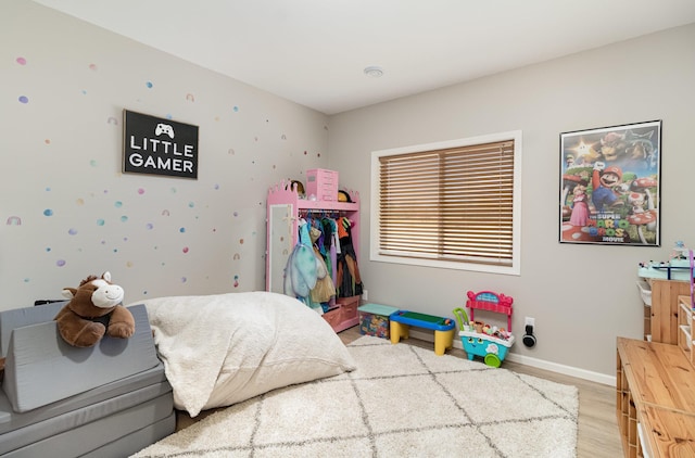 1006 9th Street Ct SE, New Prague, MN 56071 - bedroom with light wood-style flooring and baseboards