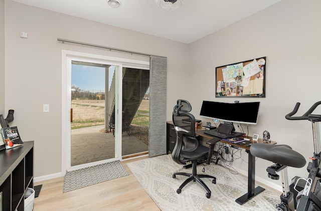 1006 9th Street Ct SE, New Prague, MN 56071 - office area featuring wood finished floors and baseboards