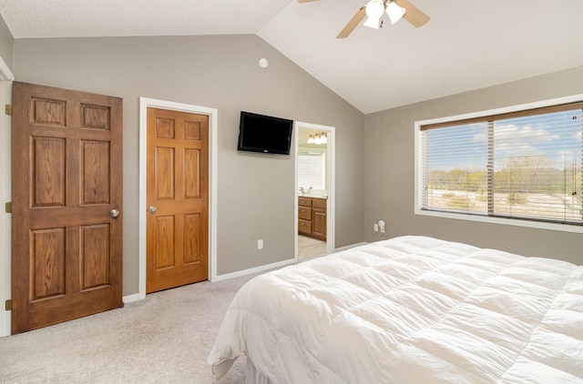 1006 9th Street Ct SE, New Prague, MN 56071 - bedroom with lofted ceiling, light colored carpet, ceiling fan, connected bathroom, and baseboards