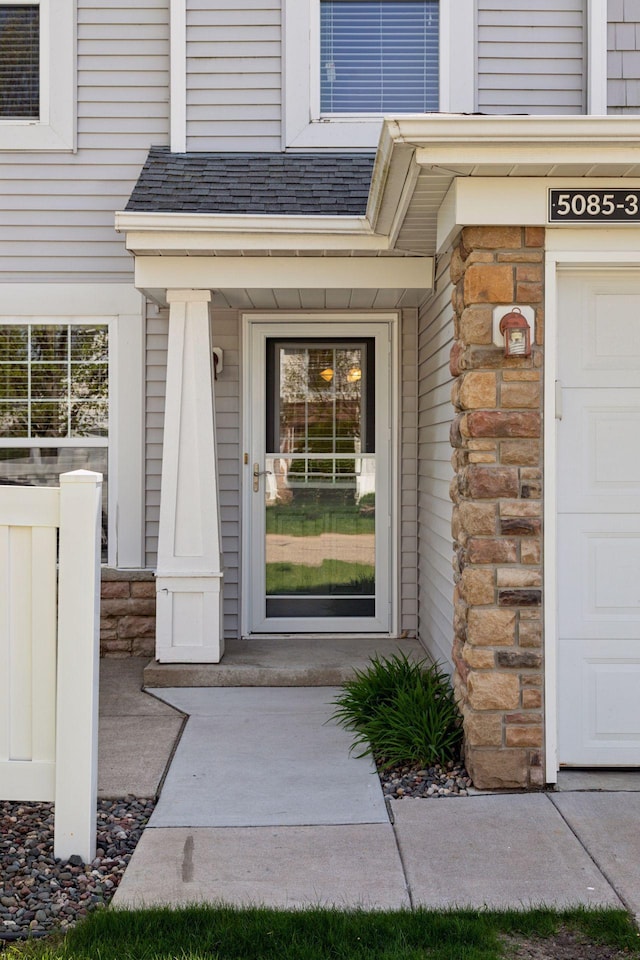 5085 149th St N # 3, Hugo, MN 55038 - doorway to property featuring a garage and stone siding