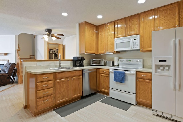 5085 149th St N # 3, Hugo, MN 55038 - kitchen with white appliances, a sink, light countertops, ceiling fan, and recessed lighting