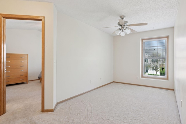 5085 149th St N # 3, Hugo, MN 55038 - carpeted spare room featuring ceiling fan, baseboards, and a textured ceiling