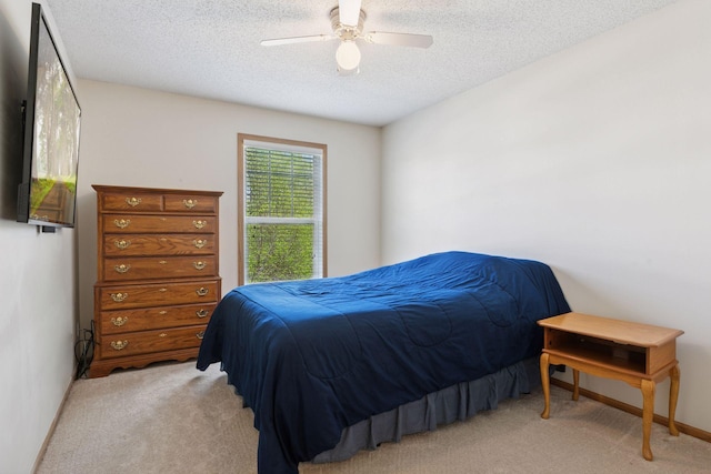 5085 149th St N # 3, Hugo, MN 55038 - carpeted bedroom with a textured ceiling, a ceiling fan, and baseboards