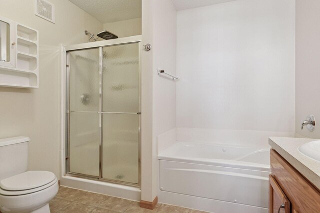 5085 149th St N # 3, Hugo, MN 55038 - bathroom with a stall shower, toilet, a bath, vanity, and tile patterned flooring