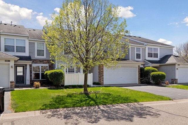 5085 149th St N # 3, Hugo, MN 55038 - view of front facade featuring stone siding, driveway, and a garage