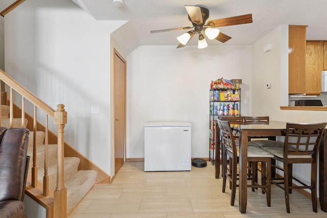 5085 149th St N # 3, Hugo, MN 55038 - dining room featuring ceiling fan, stairway, and baseboards