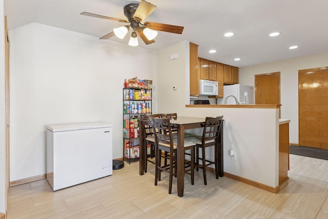 5085 149th St N # 3, Hugo, MN 55038 - dining space featuring a ceiling fan, recessed lighting, and baseboards