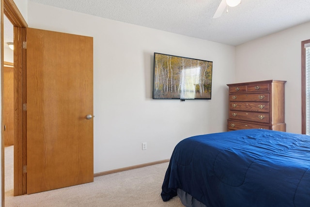 5085 149th St N # 3, Hugo, MN 55038 - bedroom featuring carpet flooring, a textured ceiling, ceiling fan, and baseboards