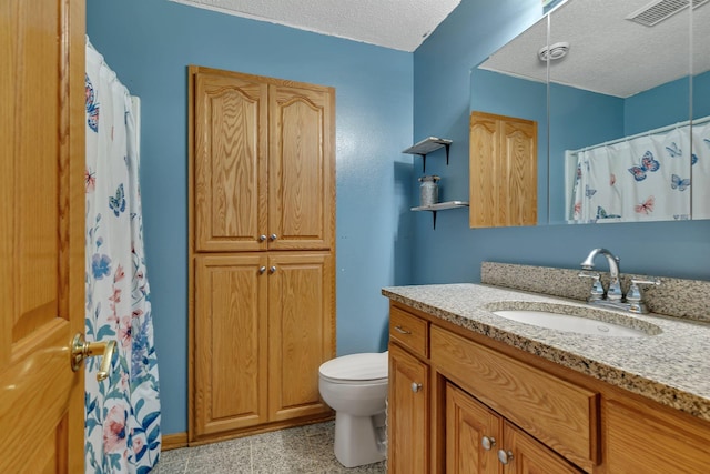 bathroom with a textured ceiling, visible vents, vanity, toilet, and a shower with shower curtain