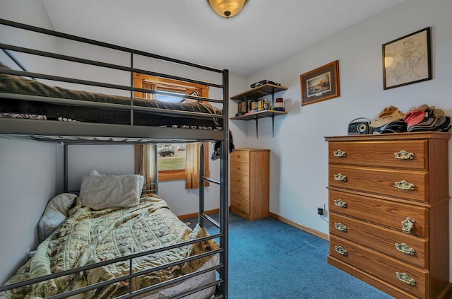 carpeted bedroom with baseboards
