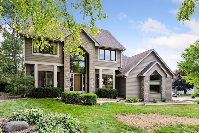 3838 Bridgewater Dr, Eagan, MN 55123 - view of front of house with a front lawn, brick siding, and a shingled roof