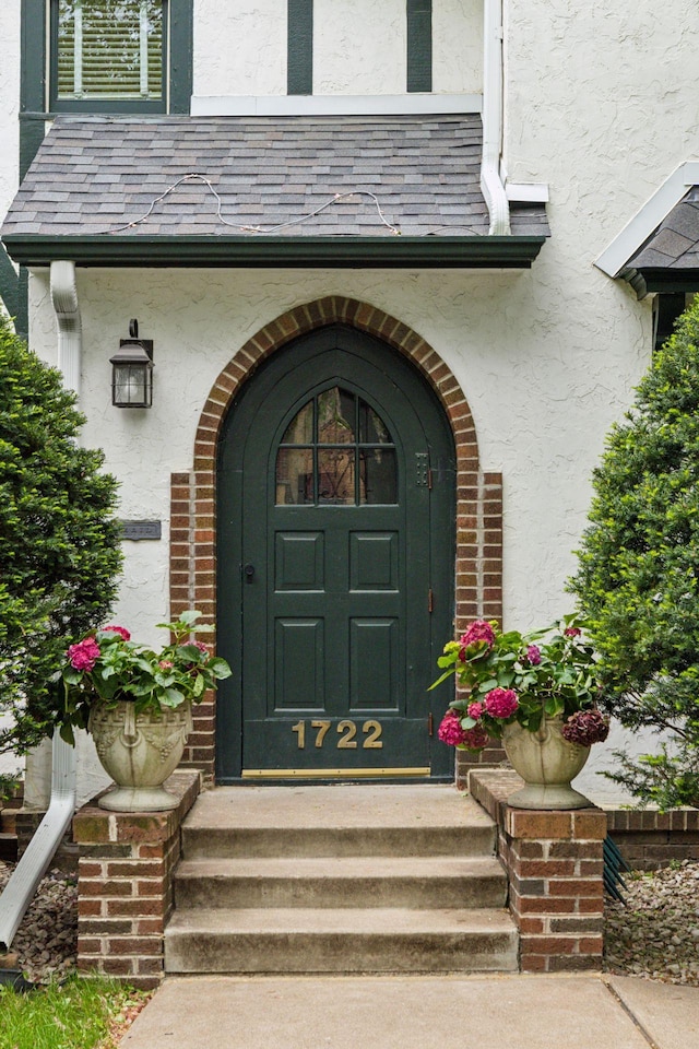 1722 Pinehurst Ave, Saint Paul, MN 55116 - property entrance featuring stucco siding and a high end roof