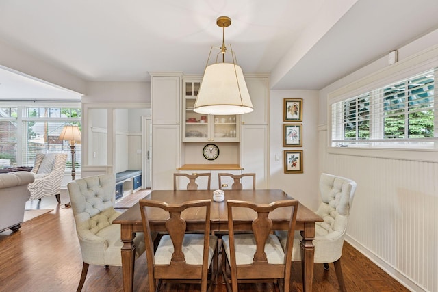 1722 Pinehurst Ave, Saint Paul, MN 55116 - dining space with wood finished floors and a wainscoted wall