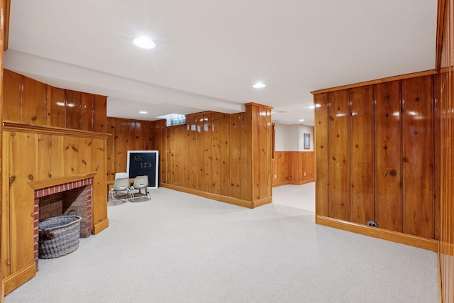 1722 Pinehurst Ave, Saint Paul, MN 55116 - unfurnished living room with carpet flooring, recessed lighting, wood walls, a brick fireplace, and baseboards