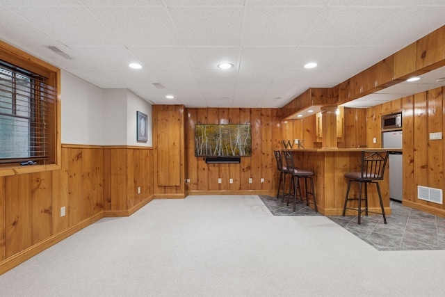 1722 Pinehurst Ave, Saint Paul, MN 55116 - indoor dry bar with stainless steel microwave, light carpet, dishwasher, wooden walls, and recessed lighting