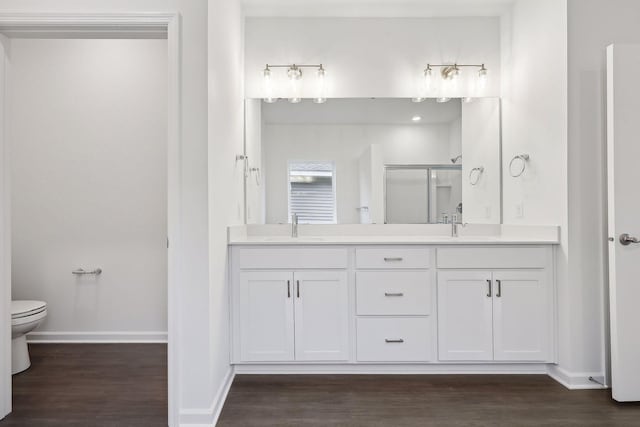 14613 105th Cir N, Maple Grove, MN 55369 - bathroom featuring a sink, a stall shower, and wood finished floors