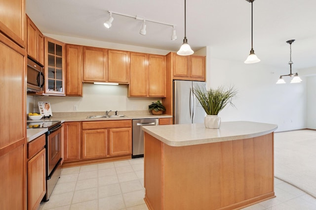 7100 Metro Blvd Unit 401, Edina, MN 55439 - kitchen featuring a sink, appliances with stainless steel finishes, decorative light fixtures, and light countertops