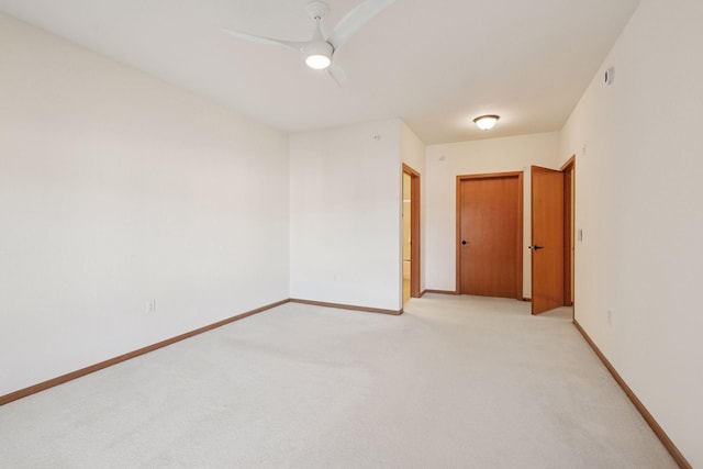 7100 Metro Blvd Unit 401, Edina, MN 55439 - empty room featuring a ceiling fan, baseboards, and light carpet
