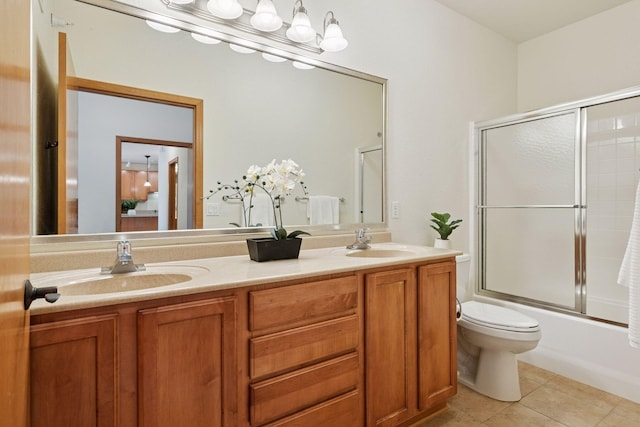 7100 Metro Blvd Unit 401, Edina, MN 55439 - full bathroom with double vanity, a sink, tile patterned floors, and shower / bath combination with glass door