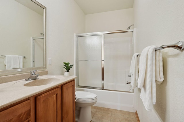 7100 Metro Blvd Unit 401, Edina, MN 55439 - bathroom with vanity, shower / bath combination with glass door, tile patterned floors, and toilet