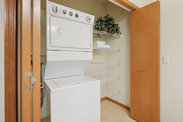 7100 Metro Blvd Unit 401, Edina, MN 55439 - laundry room featuring laundry area, light tile patterned flooring, and stacked washer / dryer