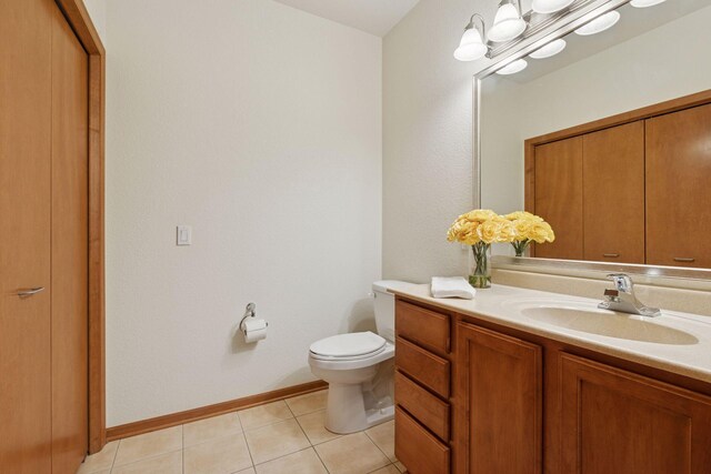 7100 Metro Blvd Unit 401, Edina, MN 55439 - bathroom with baseboards, tile patterned flooring, vanity, and toilet